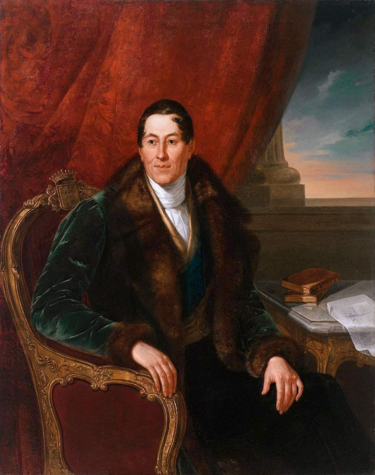 Obraz - portret mężczyzny w historycznym stroju siędzącym na fotelu.
