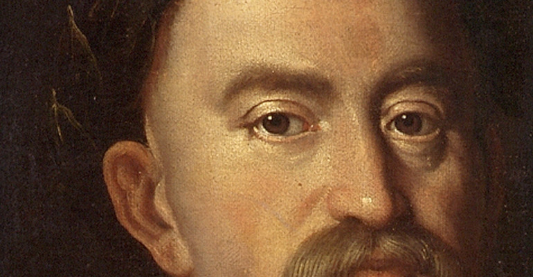 Zbliżenie na fragment obrazu olejnego "Jan III Sobieski w wieńcu laurowym". Twarz króla w zbliżeniu. brązowe, spokojne oczy, długi nos, wąsy. 